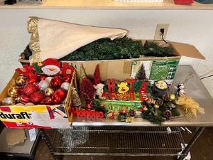 lot 86 image: Christmas Starter Lot - 6.5ft Colorado Pine Tree w400 Pre-strung Lights  Ornaments  Decorations  Pine Cones  Signs  Ribbons  Tree Skirt