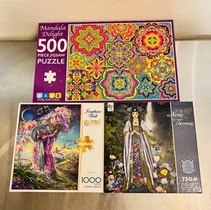 lot 115 image: Three Jigsaw Puzzles - Mandala Delight 500pc, Nene Thomas 750pc and Aquarius 1000pc