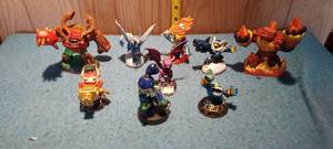 lot 81 image: assortment of Skylander action figures on bases
