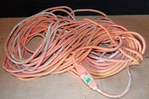 lot 243 image: LARGE ORANGE EXTENSION CORD - 75 FEET (POSSIBLY 100)
