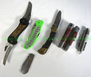 lot 89 image: Pocket knives including Buck 112 folding knife, Motorola promotional multi tool, and more