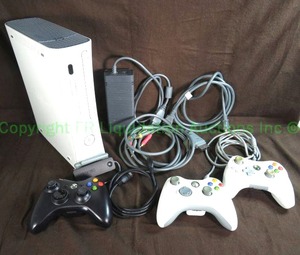lot 5 image: Microsoft XBox 360 with 3 controllers, power cords, and video cables (powers on)