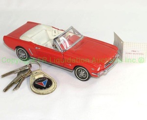 lot 21 image: 1964 12 Ford Mustang convertible model and vintage 1960s ignition and door keys, including Ford Mustang, Plymouth keychain, and more