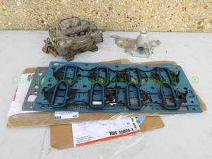 lot 45 image: Edelbrock carburetor, Aluminum Automotive water pump housing, and Fel-Pro Automotive Head, Differential and Exhaust Gaskets