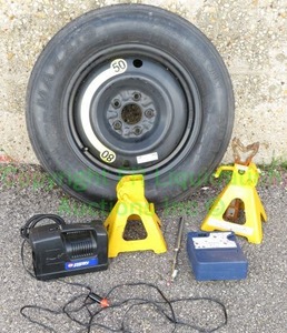 lot 47 image: Maxxis Spare Tire, Jacks Stands, Tire pressure gauge, and Campbell Hausfeld portable mini air compressor