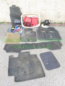 lot 48 image: Automotive lot with car mats including brands Ford, Chevrolet, Mercedes, two fuel containers, jumper cables and more car accesories
