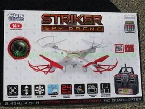 lot 2 image: World Tech Toys Striker spy drone in box, includes remote control