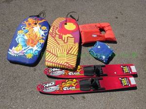 lot 140 image: Club Trainer water skis, boogie boards, and Stearns adult-size and Op childrens life vests
