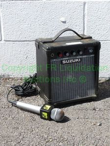 lot 107 image: Suzuki SGA 10 small amplifier and MTV microphone