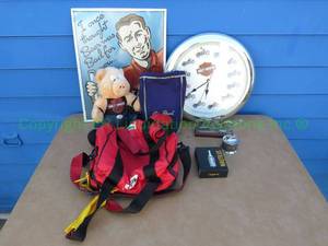 lot 125 image: Harley Davidson collectibles, Marlboro bag, and more