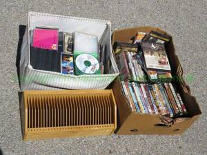 lot 111 image: DVDs and CDs with organizer, generous quantity