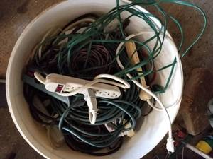 lot 325 image: Plastic tub full of extension cords and power strips (G)