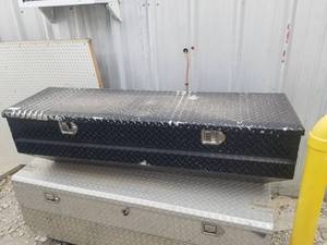 lot 241 image: Black toolbox fits inside bed of truck