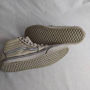 lot 221 image: VANS SIZE 10.5 MEN OFF WHITE CARTOON HIGH TOPS