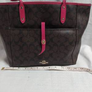 lot 61 image: COACH PURSE PINK AND BROWN