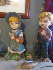 lot 25 image: Two 19 porcelain dolls 1 girl with school desk 1 boy fishing