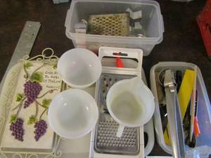 lot 34 image: Cutting board, sauce bowls, cookie cutters, small measuring cup, and nut cracker