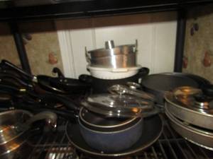 lot 36 image: Mixed lot- sauce pans, skillets, strainers, pie pans and more