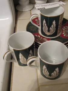 lot 51 image: Three Neiman Marcus tea cups with 4 matching saucers