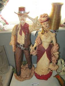 lot 70 image: Western man & woman porcelain figurines - Man  stands 24   & woman stands 22