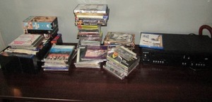 lot 79 image: Large lot of VHS tapes and DVD movies CD music VHSDVD combo player unknown working condition