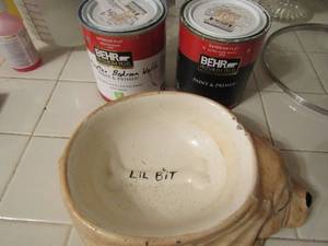 lot 142 image: Lil bit dog water dish and 2 used Behr cans of paint