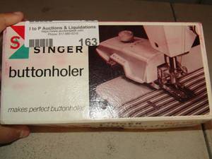lot 163 image: Singer button holder used 1561