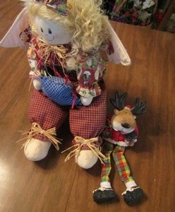 lot 172 image: Edge sitting fireplace deer and doll in rocking chair
