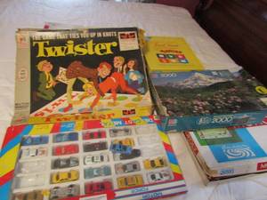 lot 178 image: Vintage board games and cards (unknown if any complete) Monopoly, twister, trivial pursuit , motor force car set and more