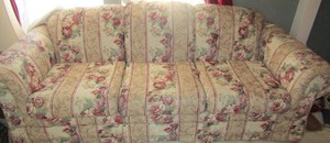 lot 77 image: Ashley furniture  floral  full size sofa good condition