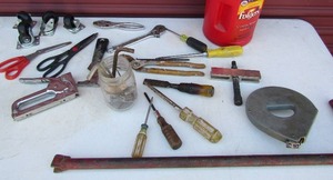 lot 212 image: Tool lot- hand staple gun, scissors, plyers, screw drivers and more