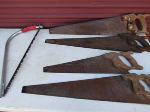 lot 213 image: 4 hand saws, 1 bow hand saw in good condition