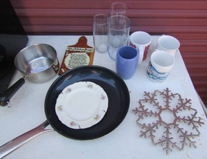 lot 217 image: Tea glasses, coffee cups, pans, skillet, kitchen prayer