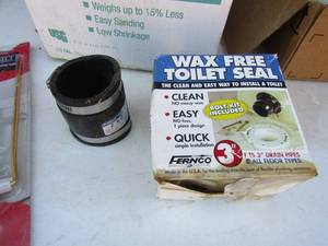 lot 227 image: Box  of misc. PVC pipe fittings, NEW wax toilet ring, assorted levels
