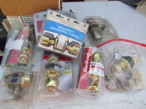 lot 230 image: Large lot of light fixtures new and used , door knobs, locks, 1 screen door hinge