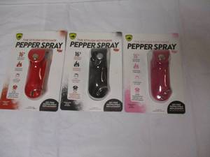 lot 50 image: 3-NEW- GUARD DOG-PEPPER SPRAY, THE STYLISH KEYCHAIN, 1-Black, 1-Pink And 1-Red Caring Cases