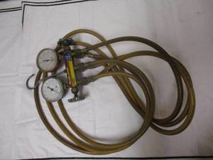 lot 116 image: Richie - Yellowjacket Test And Charging Manifold WIth Gauges For R12, R22 And R502
