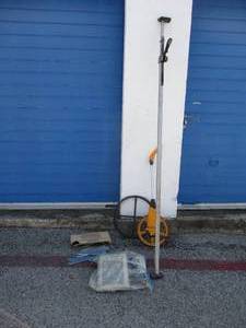 lot 91 image: Mixed Lot- Load Lock, Rolling Tape Measure, Box of Shelf Brackets, Drain Snake Wire and Wall Heaters