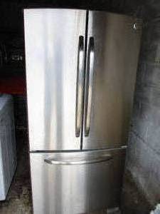 lot 11 image: G.E. Stainless Steel, French-Door Refrigerator With Bottom Freezer Model #GFSS2HCYC SS-Works