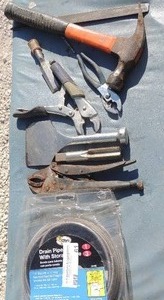 lot 61 image: Lot- hammer, chisels, plyers, drain snake, and more