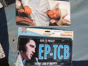 lot 79 image: Elvis license plate and garth Brooks book