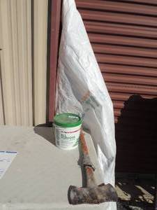 lot 163 image: Short roll of house wrap,   3 qt joint compound  ,   double bit Axe