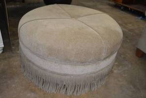 lot 25 image: 38 Round Upholstered Ottoman with Fringe Bottom Trim (Matches Lot 26)