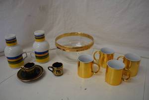 lot 17 image: Tea Cups and Saucer marked Spyropoulos Hand Made in Greece 24 K Gold,  Gold Trim Serving Bowl, Set of 4 Gold Metallic Mugs, 2-Part Striped Mug Sets