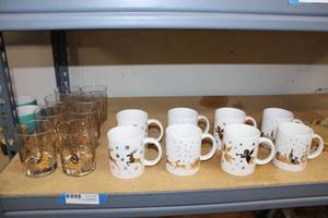 lot 74 image: Studio Nova Christmas Mug Set and Metallic Gold Painted Glass Set