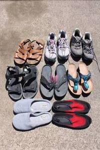 lot 95 image: Womens Shoes SAS and Khombu Sandals Size 9, New Balance and Adidas Tennis Shoes Size 11, Slippers and Water Shoes