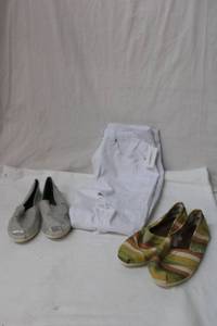 lot 102 image: Toms and White Jeans 2 Pairs of Toms Flats Size 10 and White Ripped Jeans Size 32 by Longbida