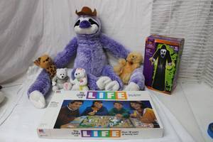 lot 104 image: Misc. Lot Large Plush Sloth, Life Board Game, Inflatable 5 ft. Reaper and More