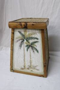 lot 107 image: Decorative Lidded with Painted Palm Trees and Basket weave Top 12 Square Base x 16 Tall