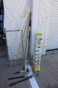 lot 108 image: Tools Yard Bag Stand, Extension Poles, Fiskars Trimmer, Pickaxe with Fiberglass Handle and Mountable Tool Organizer